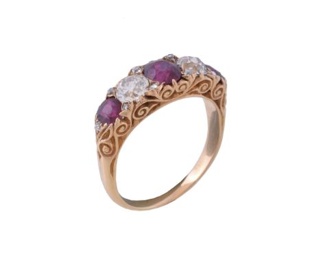  A late Victorian ruby and diamond ring,   circa 1900, the central oval cut ruby between two old cut diamonds, approximately 