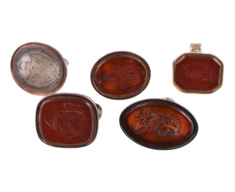  Four various gold fob seals,   unmarked, early to mid 19th century, the matrices carved with a crest, a monogram   WWP   and