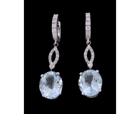  A pair of aquamarine and diamond earrings,   the oval cut aquamarine claw set below a panel of brilliant cut diamonds, suspe