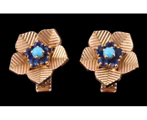  A pair of 1960s sapphire and turquoise ear clips by Cartier,   designed as flower heads, centrally set with a circular caboc