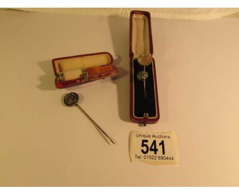 A cased cheroot holder with amber mouthpiece and 3 Victorian stick pins in case