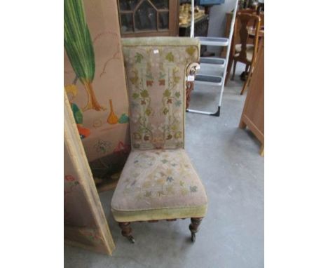 A Victorian prayer chair with tapestry upholstery
