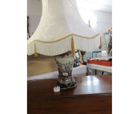 An oriental style table lamp with shade