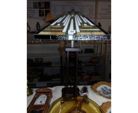 A large Tiffany style table lamp