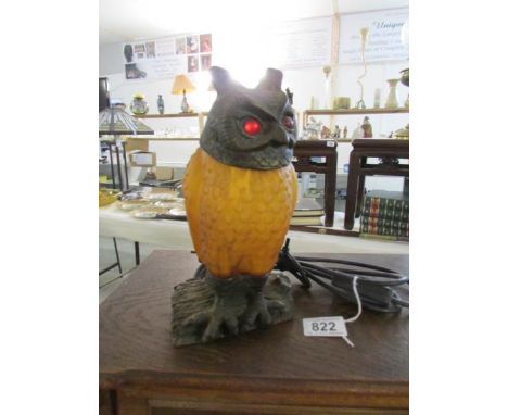 A bronzed cast iron Tiffany style owl table lamp with red jewelled eyes