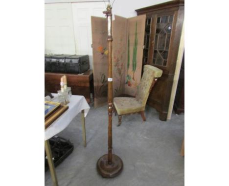 A wooden standard lamp base