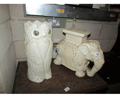 A large porcelain owl stick stand and a large elephant pot stand