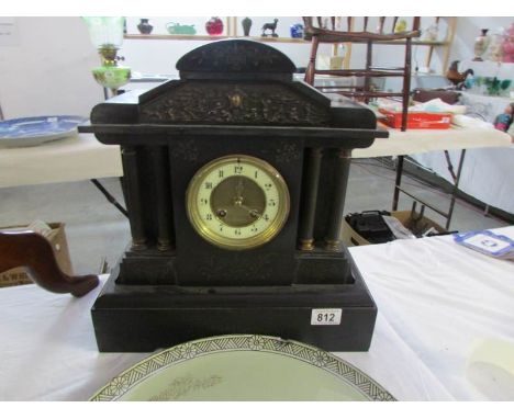 A 19th century heavy black mantel clock