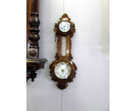 A barometer wall clock, glass a/f