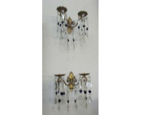 A pair of chandelier style double lamp wall lights
