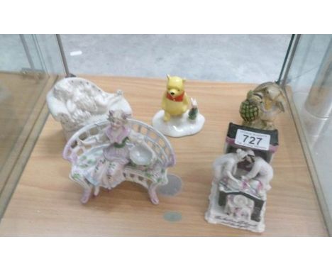 A Royal Doulton Winnie the Pooh, a Royal Albert Mr Ptolemy, A Victorian figurine of girl on bench, a fairing and one other it
