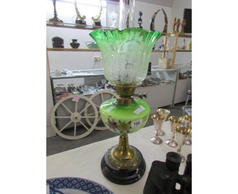 An oil lamp with shade