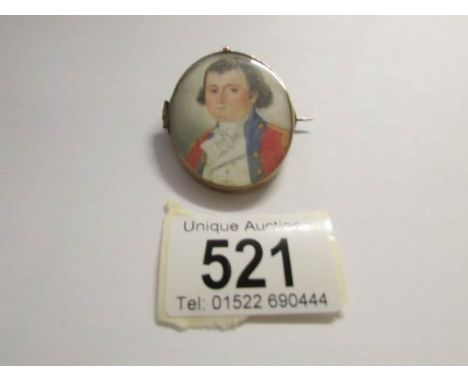 A 19th century miniature portrait pendant with hair in reverse and inscribed round edge William Godfrey Mu? (unfortunately th