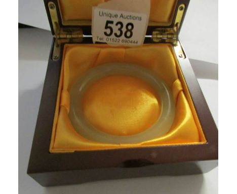 A cased jade bangle