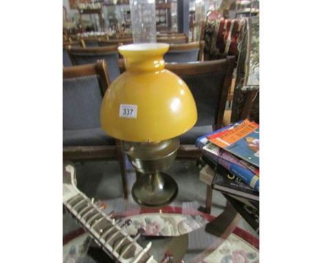 An oil lamp complete with shade