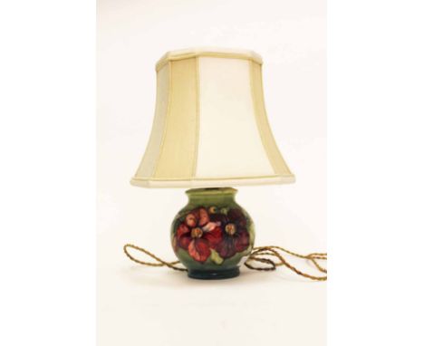 MOORCROFT CLEMATIS PATTERN LAMP BASE decorated with tube-lined flowers in pink on a mottled blue-green ground, impressed mark