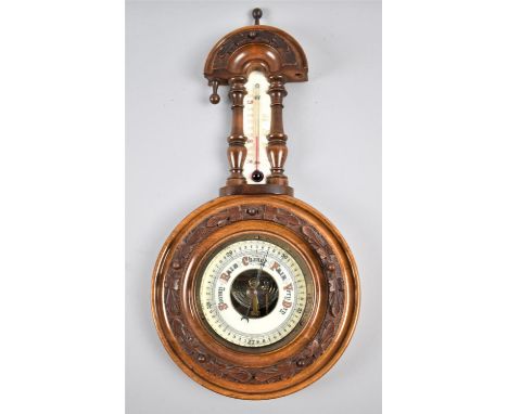 A Late Victorian Aneroid Wheel Barometer with Thermometer, Carved Oak Leaf Decoration, 40cm high 
