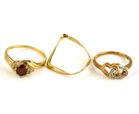 Three 9ct gold rings, to include a 9ct gold wishbone type ring, a 9ct gold two love heart ring set with CZ stones, ring size 