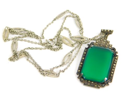 A silver and marcasite pendant, with rectangular cut green jade, with marcasite Art Deco style border, white metal, marked 93