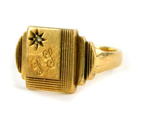 A 9ct gold signet ring, the central rectangular shield inset with tiny CZ stone in illusion setting, bearing the initials P J