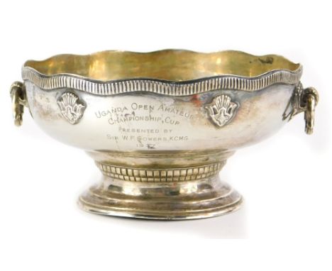 A George V small silver presentation bowl or punch bowl, with a gadrooned shaped edge, two handles, engraved Uganda Open Amat