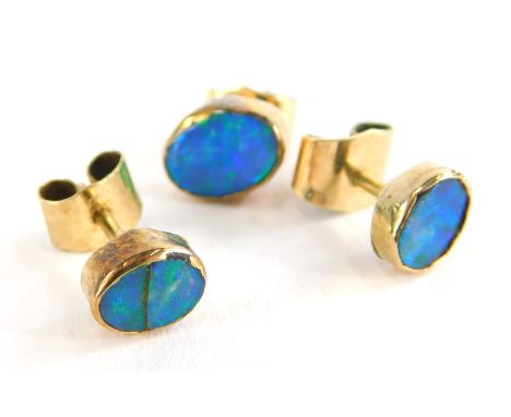 Three various opal set earrings, each set with oval cut opals in rub over setting, each with butterfly backs, yellow metal, u