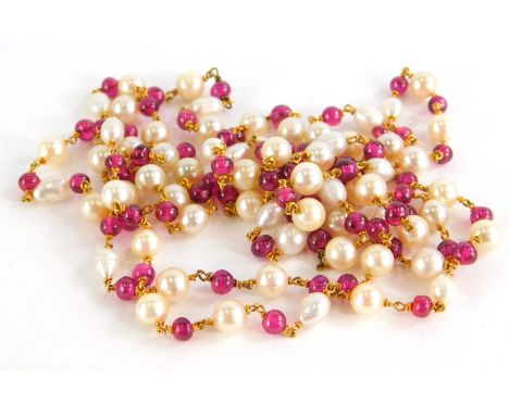 A pearl and garnet longuard necklace, with various blister and cultured pearls, with round beaded garnets, with yellow metal 