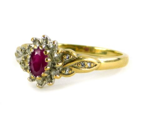 A 9ct gold floral cluster ring, set with various CZ stones and a central ruby, in a white gold settings, ring size S½, hallma