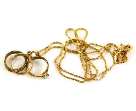 A 9ct gold pendant and chain, the three ring pendant, set with wedding band eternity ring and engagement ring, on a box link 