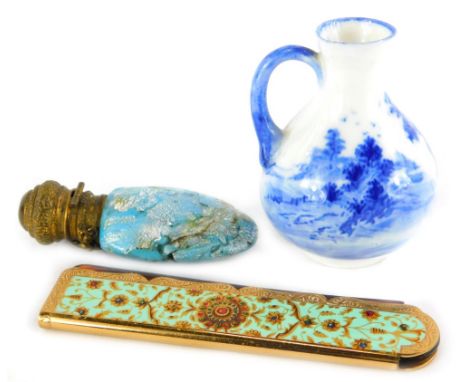 A Stratton retractable comb in enamel type case, a Royal Doulton miniature blue printed vase and a mottled glass continental 