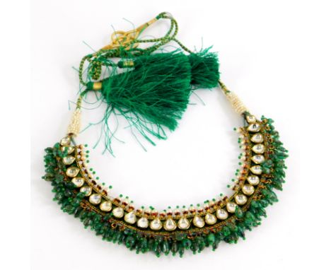 An Indian dress necklace, made up of various rectangular enamelled panels, the front set with seed pearls and clear paste sto