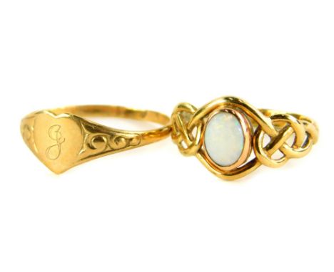 Two dress rings, to include a 9ct gold opal set dress ring, with weave design shoulders, ring size L, together with a thin 9c