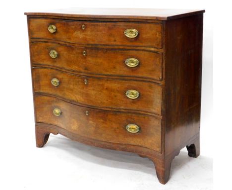 A George III mahogany and boxwood strung serpentine fronted chest, the top with a crossbanded edge, above four graduated draw