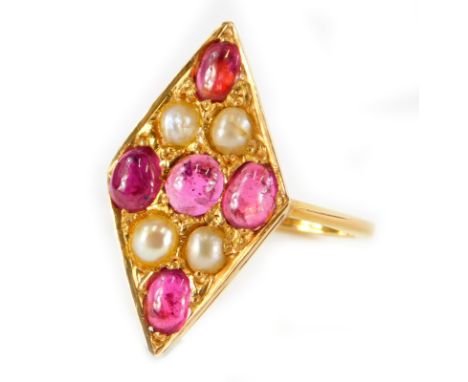 A marquise shaped ruby and pearl dress ring, the marquise design set with five rubies and four pearls, in yellow metal settin