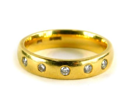 An 18ct gold diamond set half hoop dress ring, set with six illusion set tiny diamonds, ring size J, 4.7g all in.