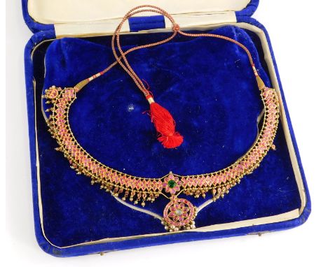 An Indian dress necklace, the necklace set with cabochon set rubies, with emerald and moon stone centre, with cultured pearl 