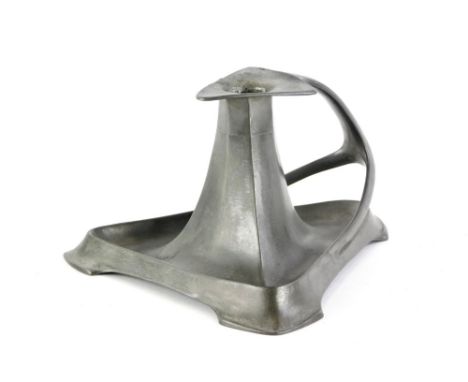 A late 19th/early 20thC art nouveau pewter chamber candlestick in the manner of Liberty, with triangular base and shaped hand