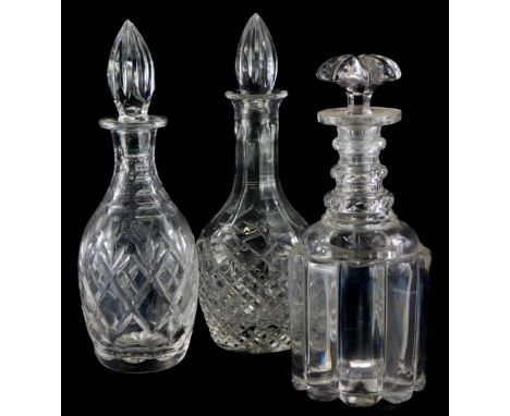 A 19thC triple ring neck decanter and stopper, 27cm high, and two other decanters. (3)