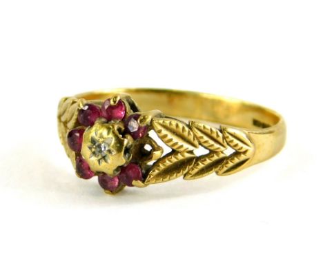 A 9ct gold dress ring, with central floral cluster set with garnets and illusion set tiny diamond, one stone missing, with a 