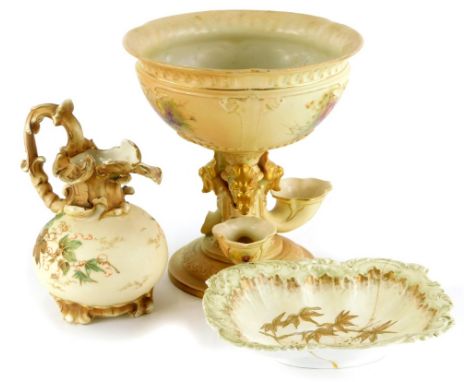 Three items of blush ivory group porcelain, a Royal Worcester centrepiece painted with flowers, on a gilt ground, 23cm high, 