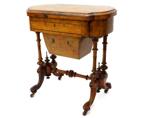A Victorian walnut games/work table, the quarter veneered top with a burr yew crossbanded border and a moulded edge, inlaid c