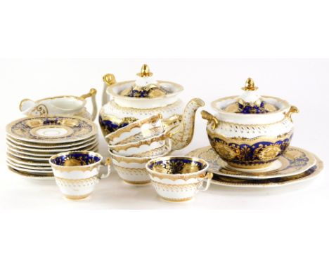 A 19thC English porcelain part tea service, decorated with leaves, scrolls, etc., in yellow on a cobalt blue ground, picked o