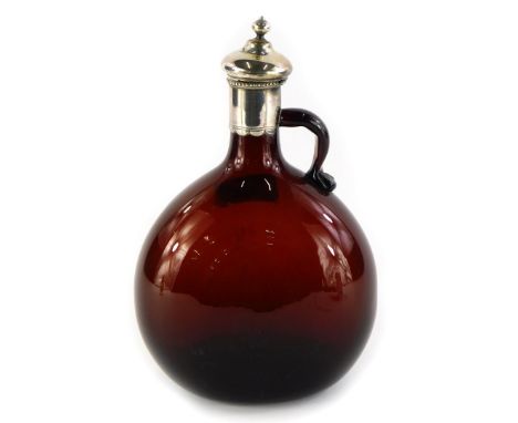 A Victorian brown tinted mallet shaped spirit decanter, with silver plated mount, unmarked, 21cm high.