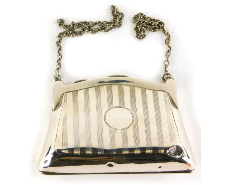 A George VI silver coin purse, with engine turned body, vacant cartouche and plain chain handle, (handle AF), Birmingham 1942