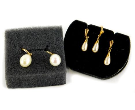 Two pairs of cultured pearl 9ct gold earrings, comprising a pair of modern curve design and single pearl drop, on butterfly b