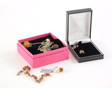 A group of amber and imitation amber jewellery, to include an amber and silver dress ring, an amber and silver pair of earrin