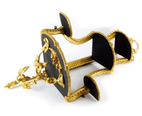 A gilt gesso corner wall bracket, decorated with ribbons. flowers, etc., with three graduated tiers and two further smaller t
