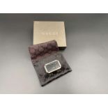 GUCCI, polished stainless steel and monogrammed leather inset money clip,