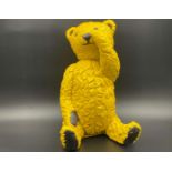 “ALL PROCEEDS TO CHARITY”. A modern cast resin model of a Teddy Bear,