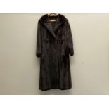 NORWICH FUR CO, early 20th century, ¾ length, dark brown fur coat.&nbsp;